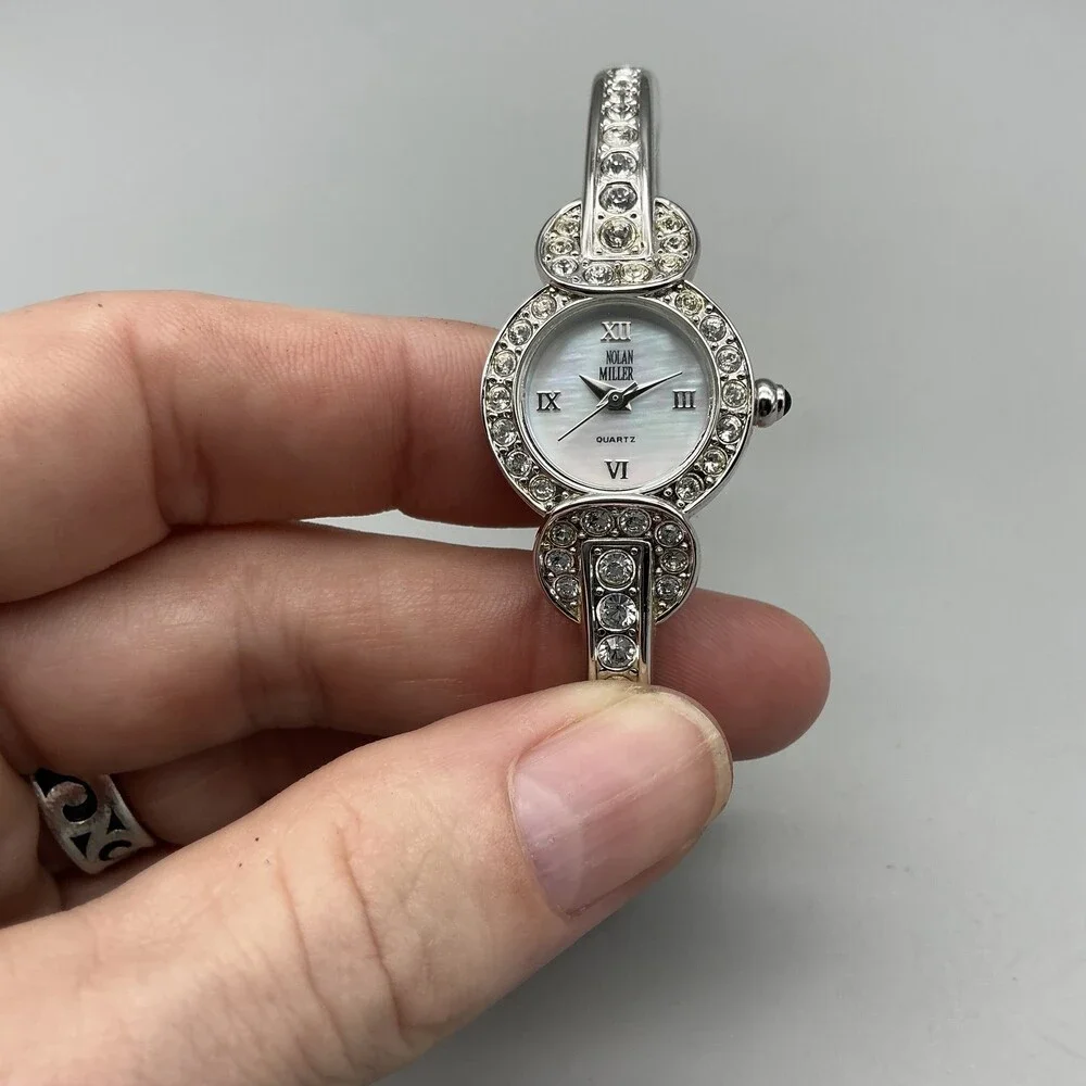 Nolan Miller Womens Watch 21mm Silver Tone MOP Dial Bangle Crystals 7